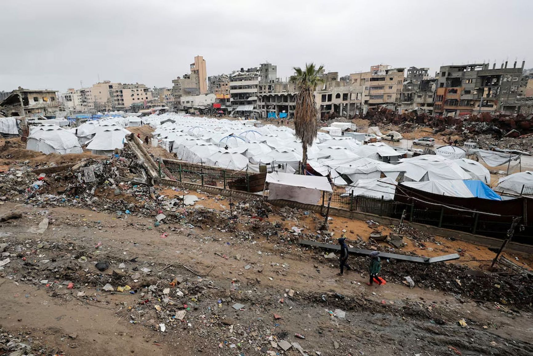Tents against the backdrop of a devastated Gaza, Gaza Strip, February 6, 2025