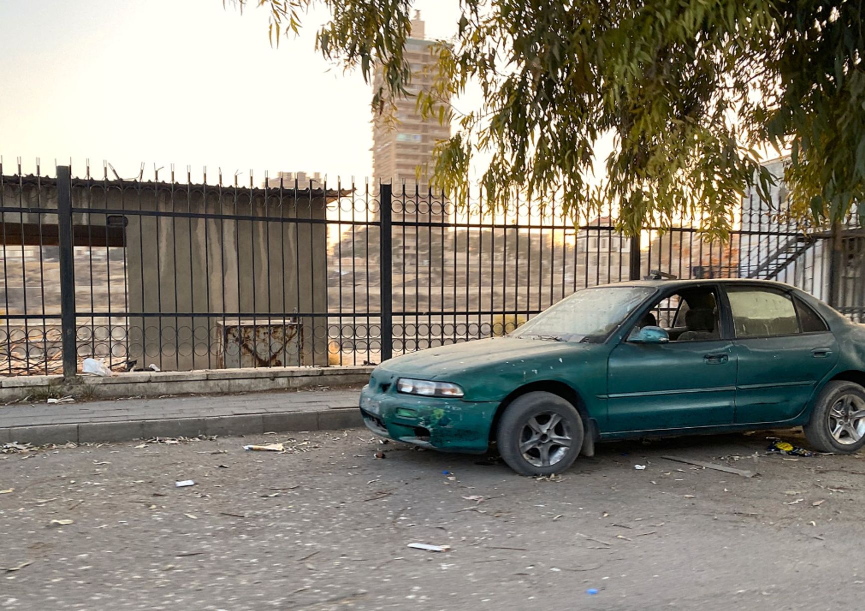 A bullet-riddled vehicle on a street in Damascus.